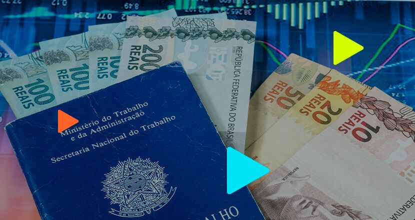 Carteira de trabalho e notas de dinheiro brasileiro.